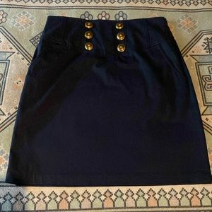 Worth skirt with button detail and pockets